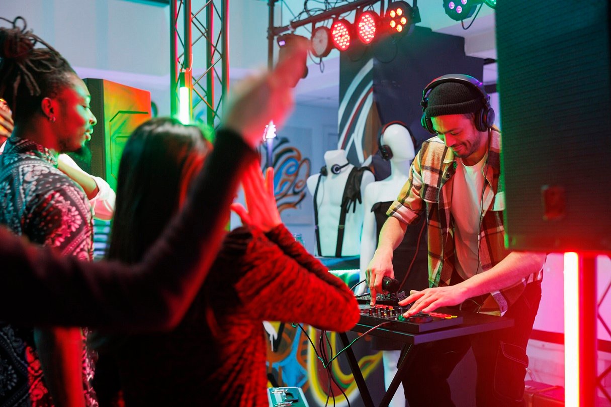 Home dj playing electronic music in club